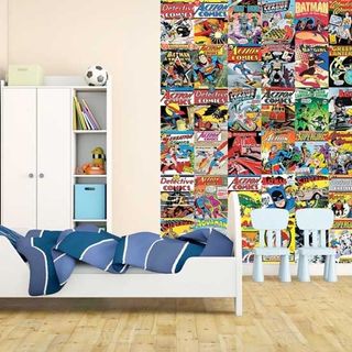 kids bedroom with comic wallpaper and small chairs