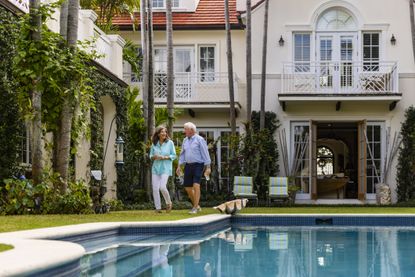 Retired couple enjoying time in their beautiful backyard.