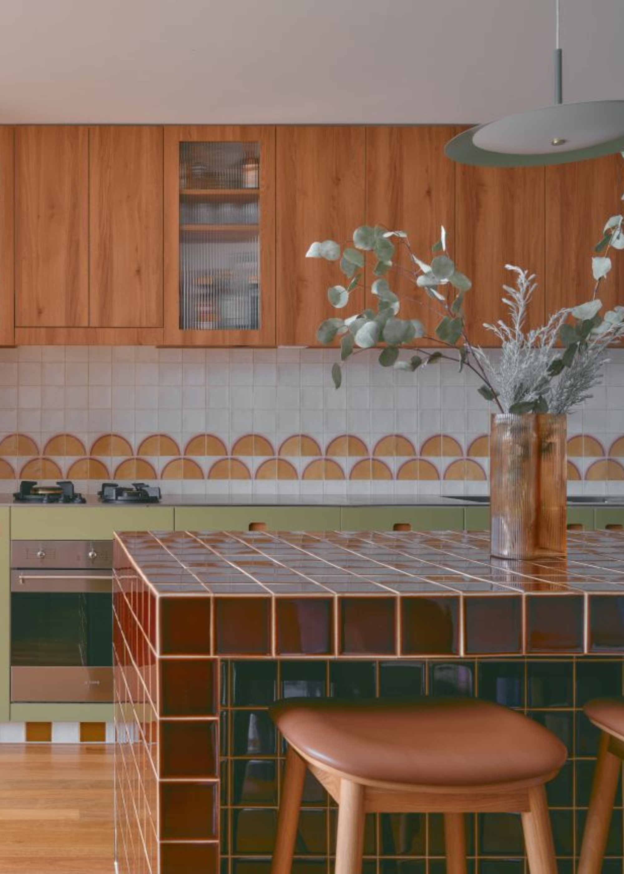 cool maroon tiled kitchen island in a retro style kitchen