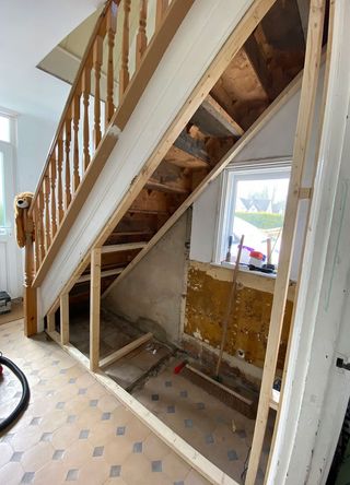 Exposed wooden staircase underneath