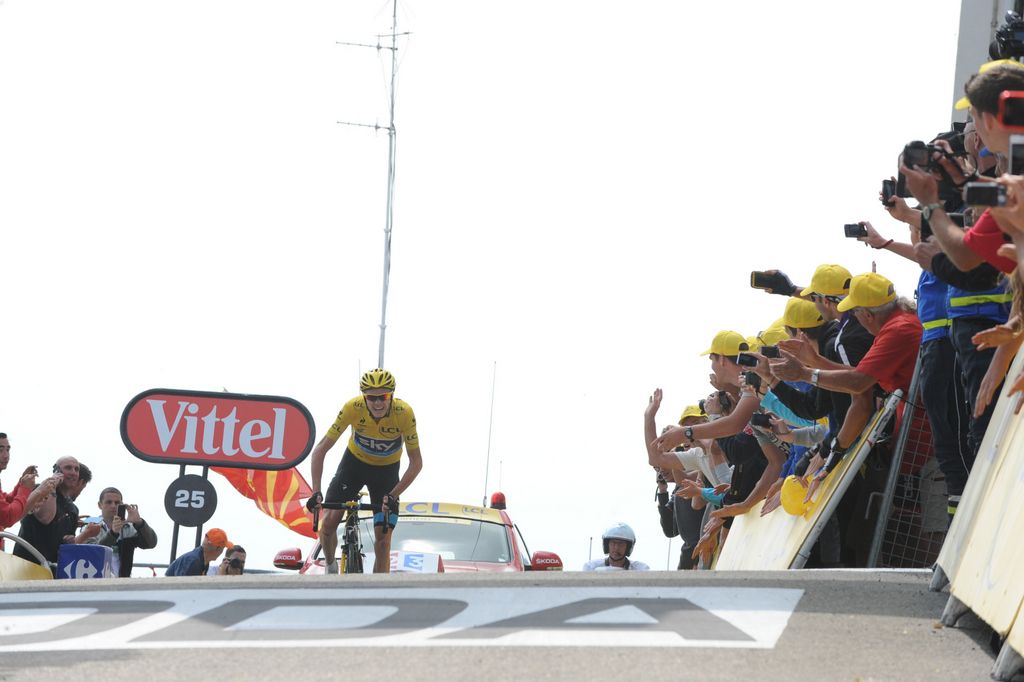 Yellow jersey wearer Chris Froome approaches the finish line 2013 to take the win