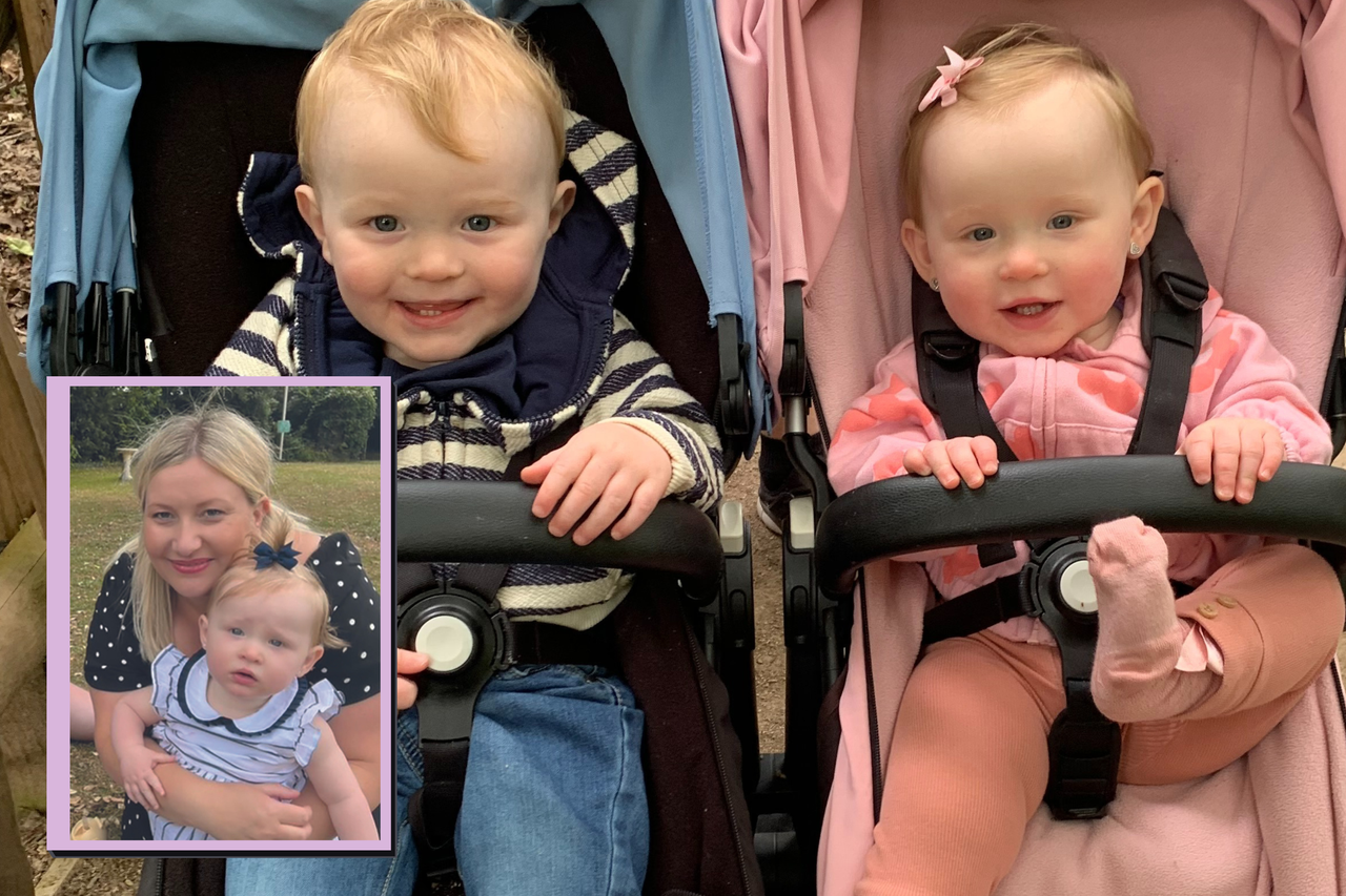 Twins sitting in their buggy 