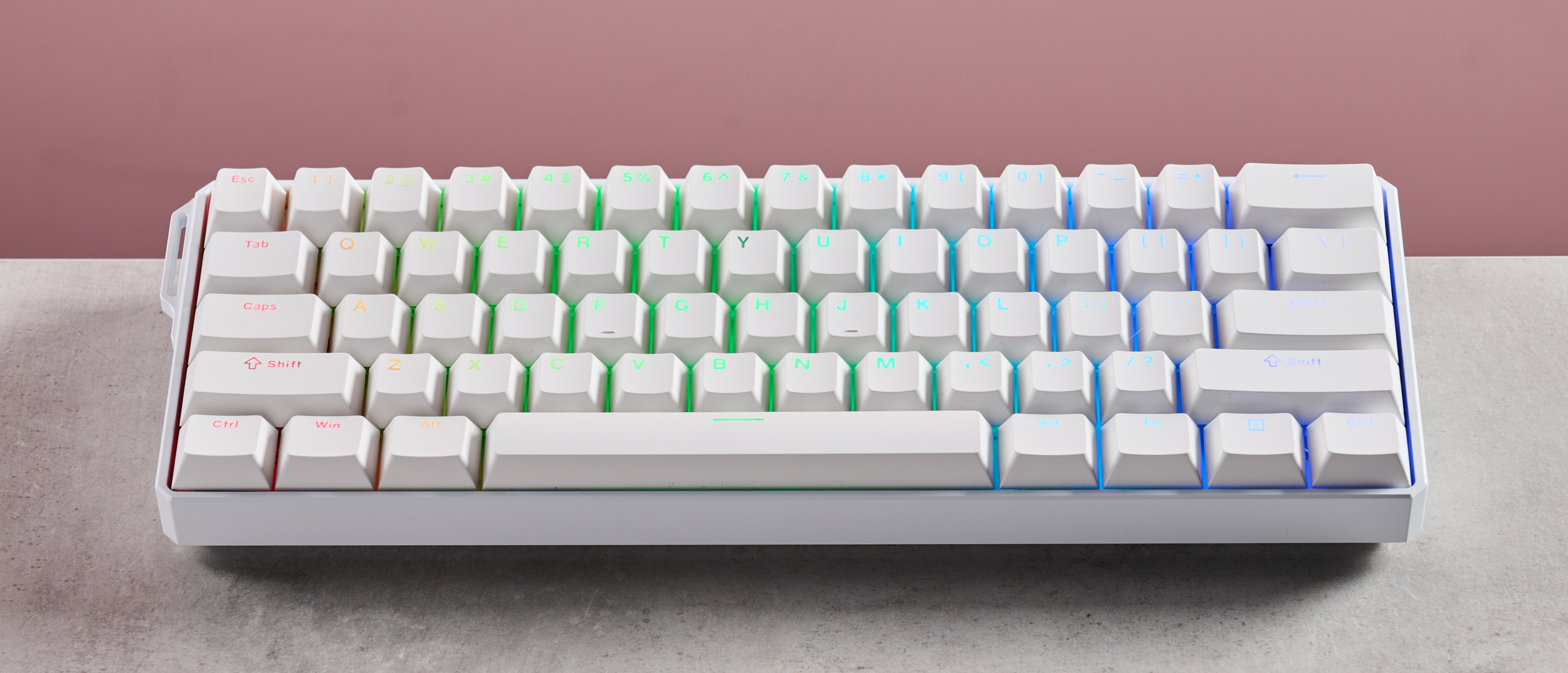 MonsGeek FUN60 Ultra on desk with pink background