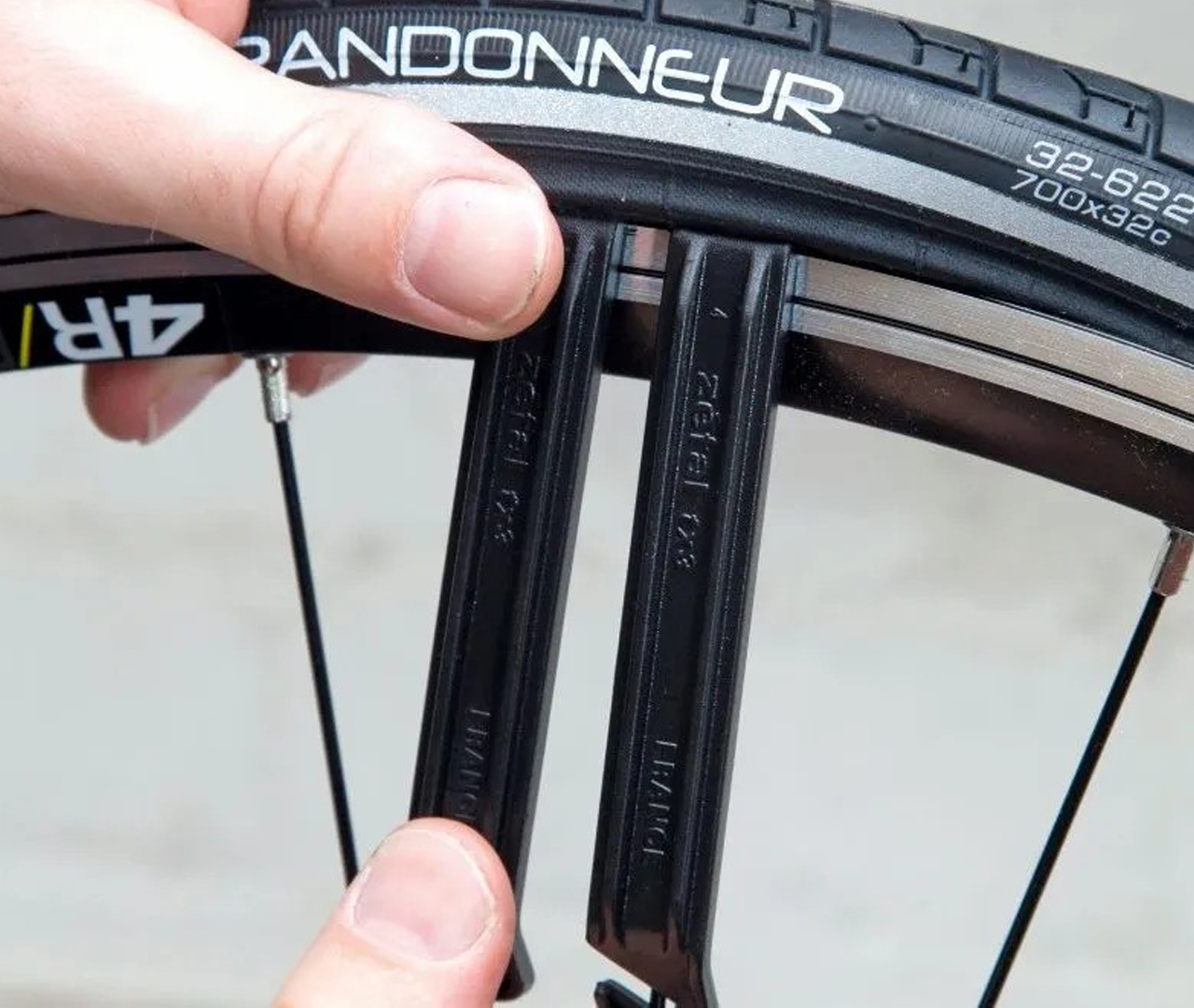 Use tyre levers to remove a tyre from the rim