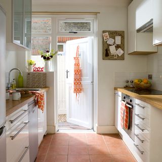 kitchen room with wooden worktop and white door