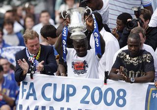 Portsmouth manager Harry Redknapp (L), Sulley Muntari (with cup) and John Utaka (R)and the rest of the Portsmouth football team parade the FA Cup through the streets of Portsmouth in an open top bus after beating Cardiff 1-0 in the FA Cup Final, Portsmouth, England, on May 18, 2008. AFP PHOTO / GLYN KIRK (Photo credit should read GLYN KIRK/AFP via Getty Images) Jose Mourinho