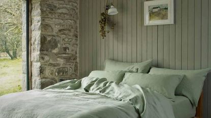 Some of the best cooling sheets - the Sage Green Linen Bedding Set on a bed.