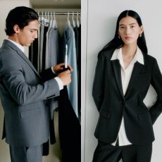 A female model and a male model wearing tailored suits from Theory in front of a wardrobe filled with more suits. 