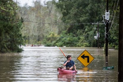 A man kayaks in Columbia, South Carolina.