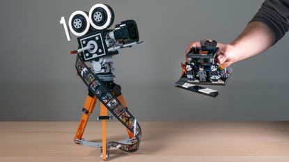 Lego Walt Disney Tribute Camera (43230) with hand holding the multi-plane camera side build 