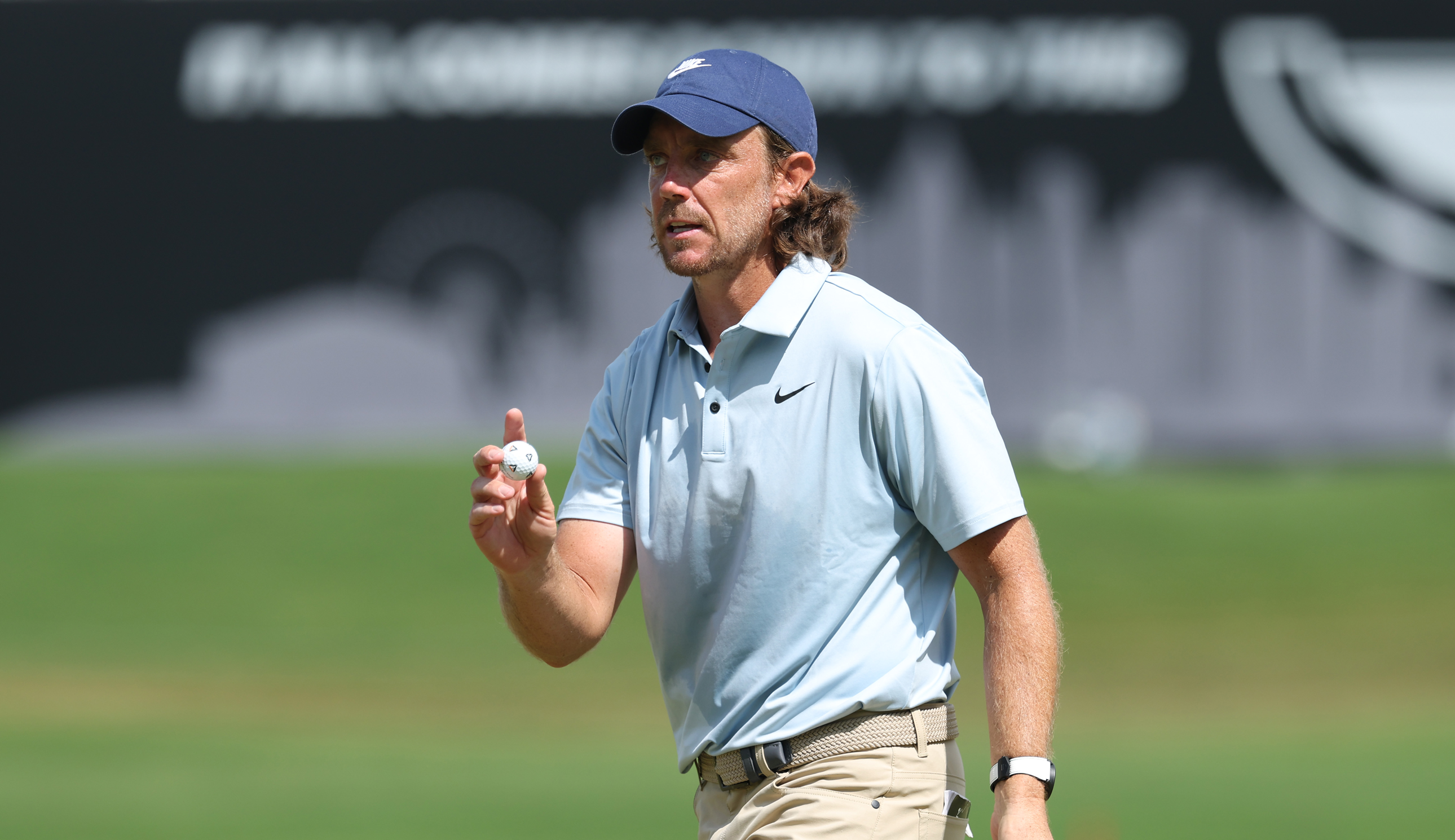 Tommy Fleetwood waves to the crowd