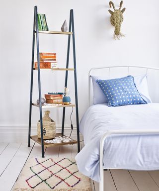 Ladder shelf in bedroom by Oliver Bonas