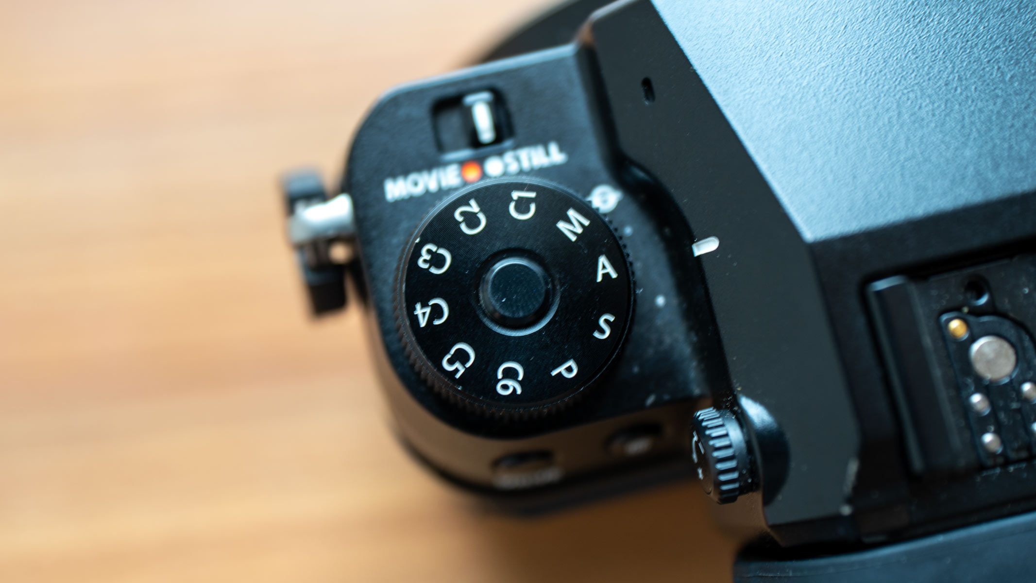 A close up of the mode dial on the Fujifilm GFX100S II.