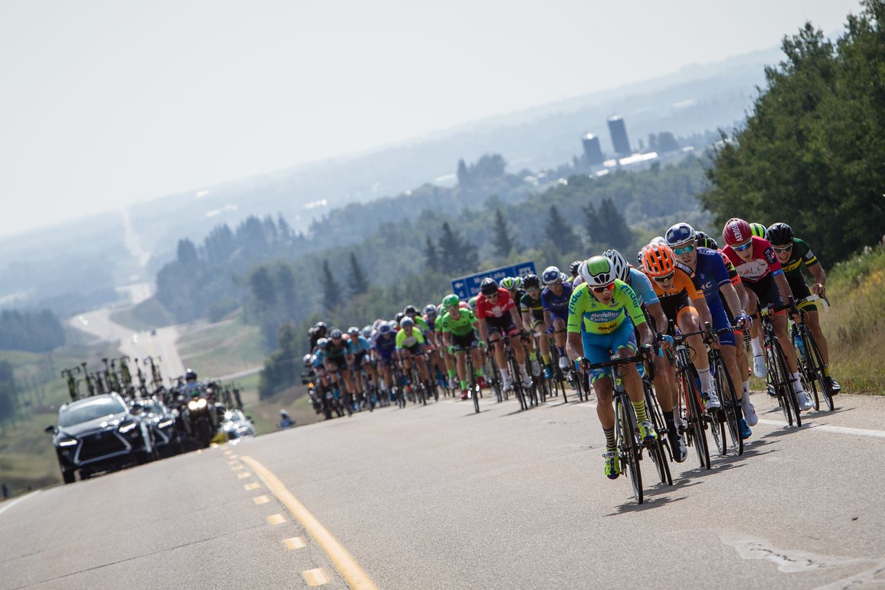The peloton rides on rolling roads during stage 2 at the Tour of Alberta