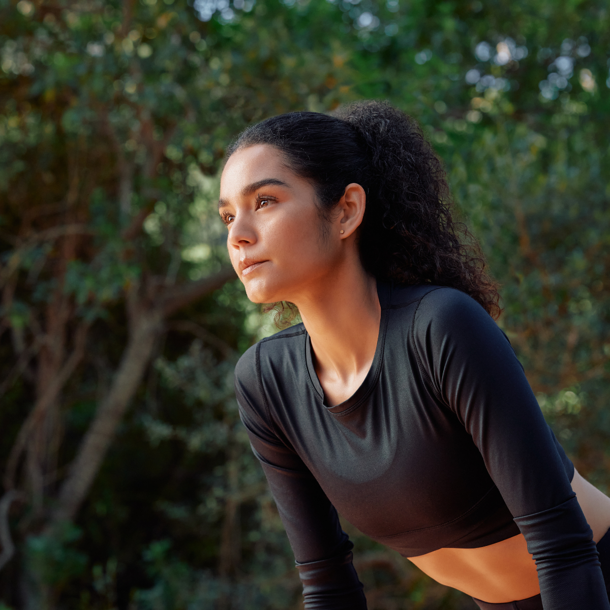 Downtime guilt: A woman resting after her workout but feeling guilty for doing so