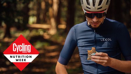 Male cyclist eating an energy bar