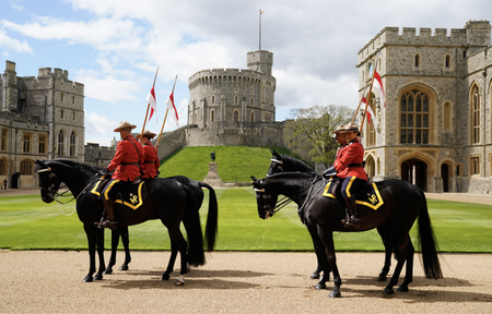 Members of the Royal Canadian Mounted Police (RCMP) ahead of a ceremony where King Charles III formally accepts the role of Commissioner-in-Chief of the RCMP, in the quadrangle at Windsor Castle on April 28, 2023 in Windsor, England.