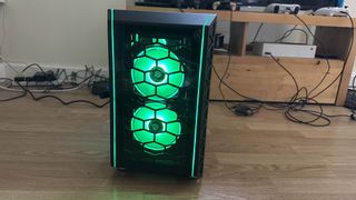 The Refract Jade PC with green lighting from the front