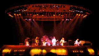 Electric Light Orchestra onstage under a giant spacecraft lighting rig