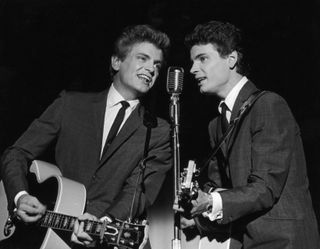 1962: Phil (left) and Don Everly, the American rock n' roll duo the Everly Brothers on stage.