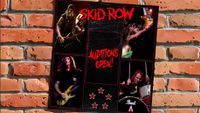 Skid Row poster on a brick wall