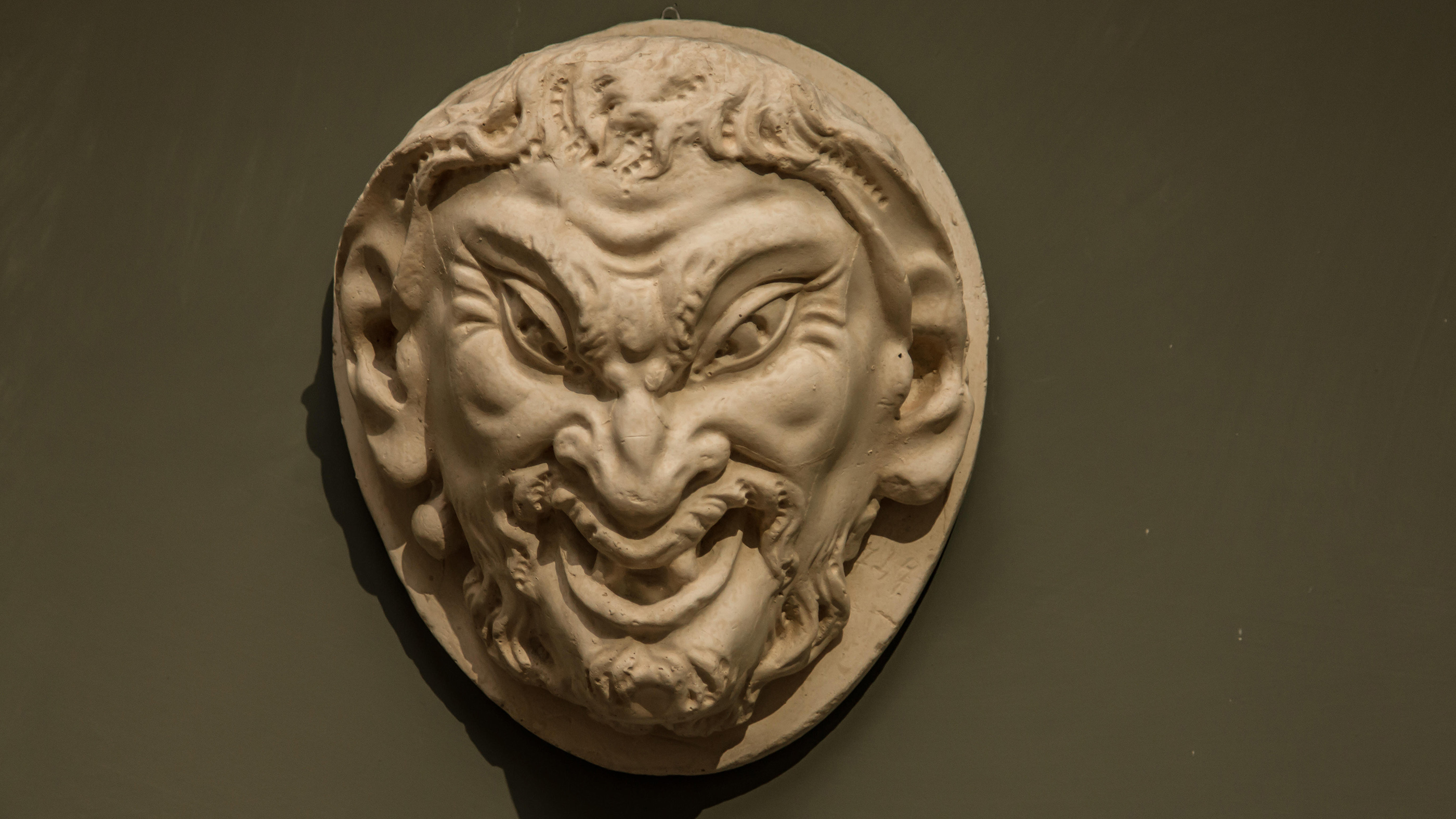 The mask of a faun by Michelangelo.