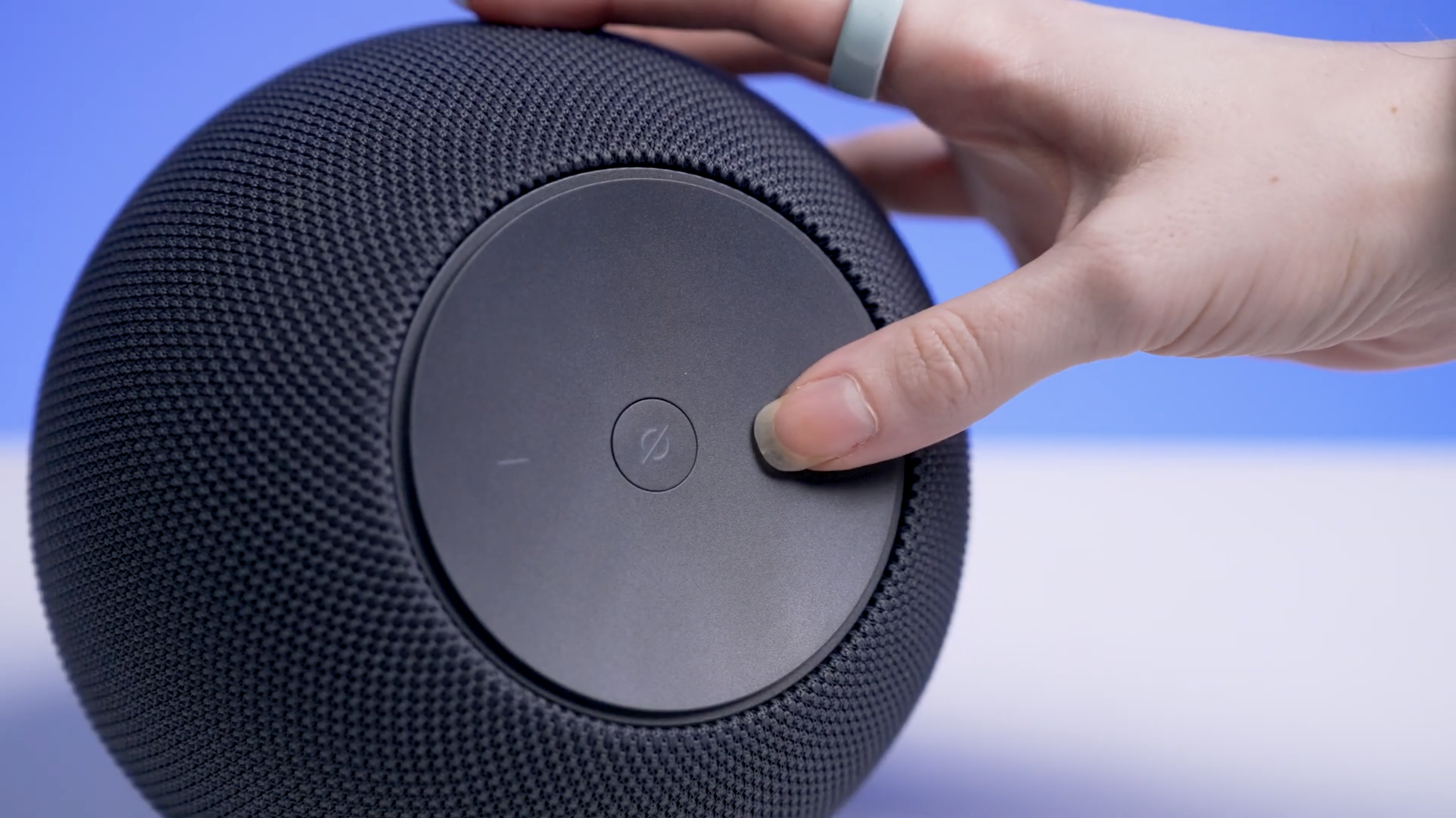 Echo Studio (2nd gen, 2025) being pressed by a hand