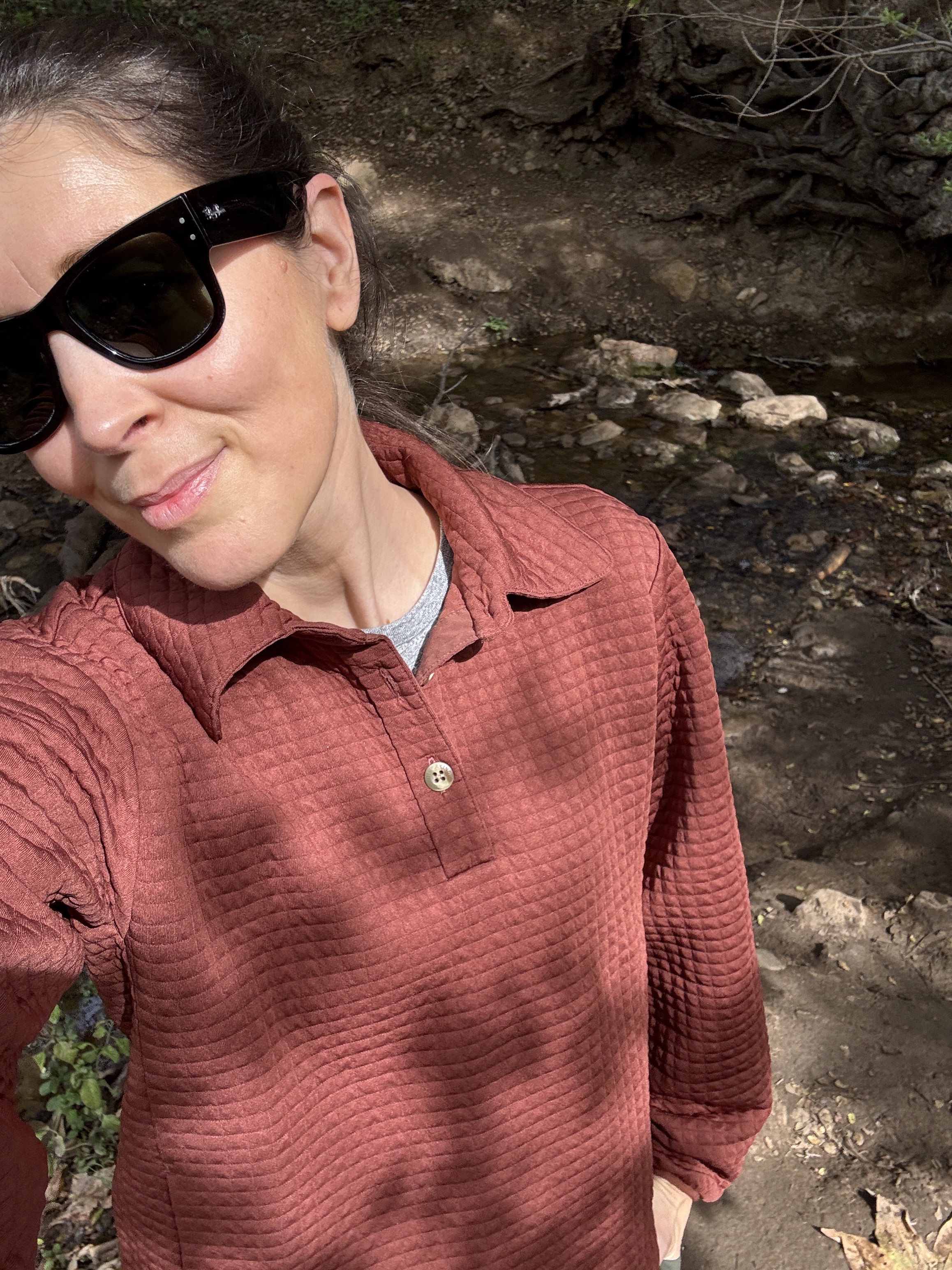 Woman in Hikerkind sweatshirt.