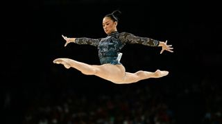 Team USA&#039;s Sunisa Lee leaps into the splits off the balance beam in a star-spangled leotard at the 2024 Paris Olympics Games.