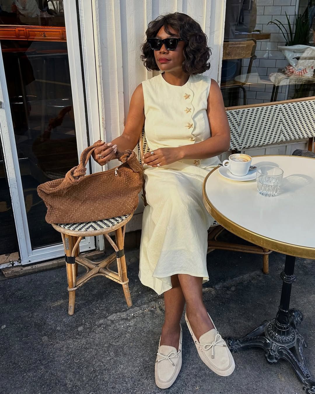 woman in linen set and soft loafers
