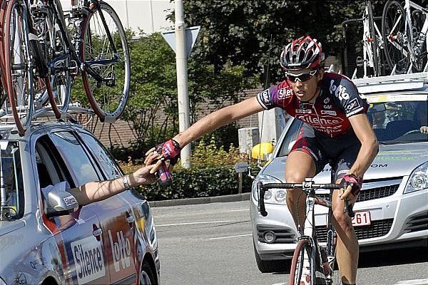 Geert Steurs (Silence - Lotto) takes a drink from the team car.