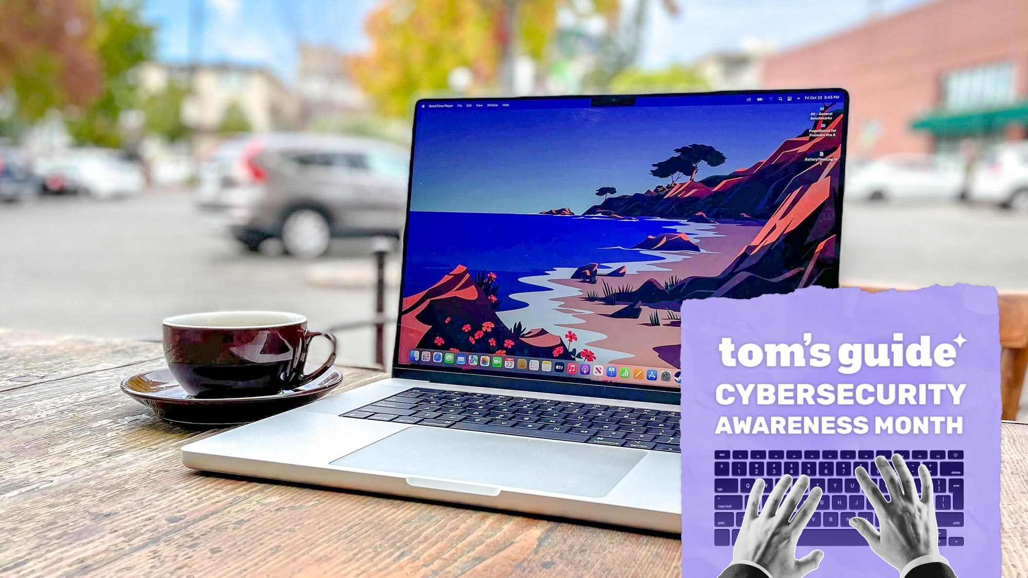 A MacBook on a table with a Tom's Guide Cybersecurity Awareness Month badge