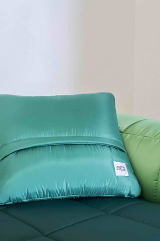 Vetsak x Aspesi Transformation green sofa and bright cushions