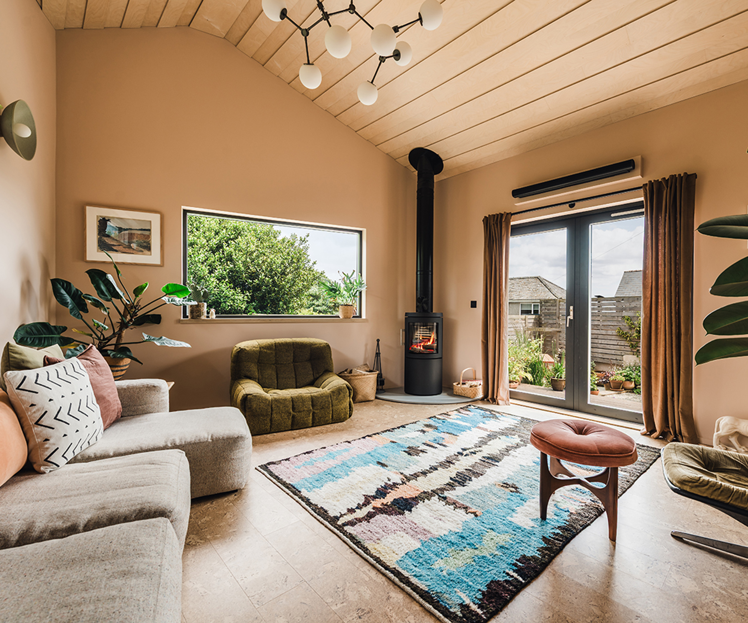 Interior of a bungalow renovation with log burning stove and cosy interiors