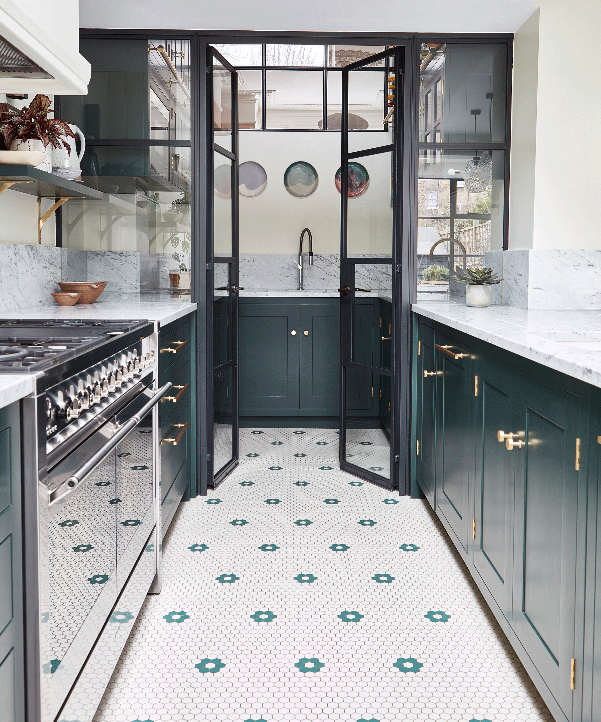 Galley kitchen with penny tiles and blue cabinetry