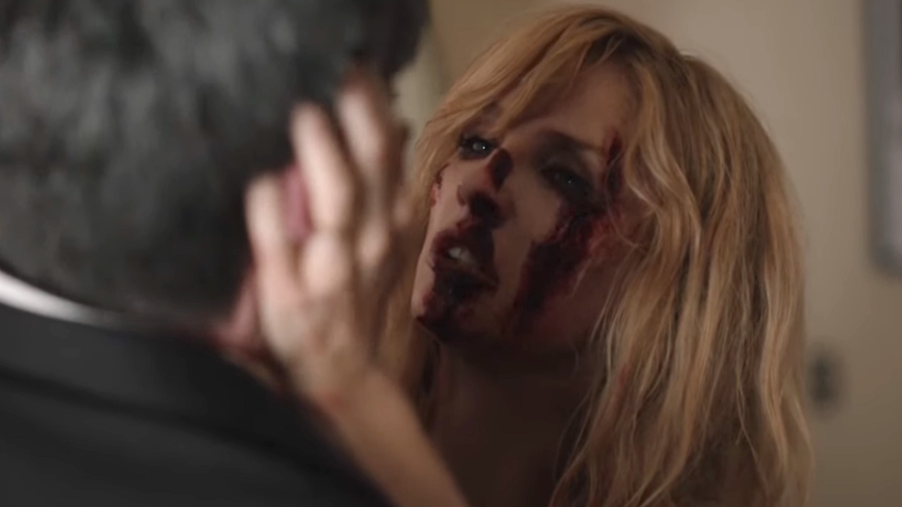 Bloody-faced Beth holds dying Jamie by the head after she stabbed him in Yellowstone finale.