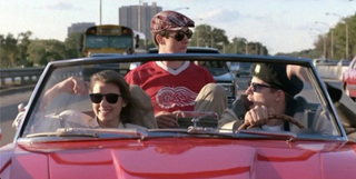 Mia Sara, Alan Ruck, and Matthew Broderick in a convertible car in Ferris Bueller’s Day Off