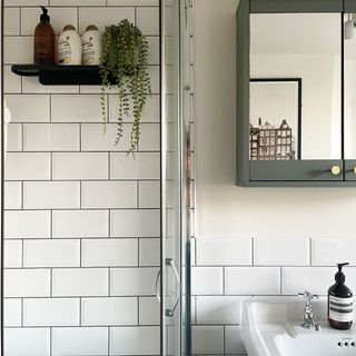Bright airy bathroom with metro tiling and built-in storage