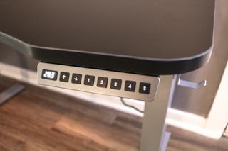 The digital keypad and built-in headphone hook on the X-Chair Standing Desk