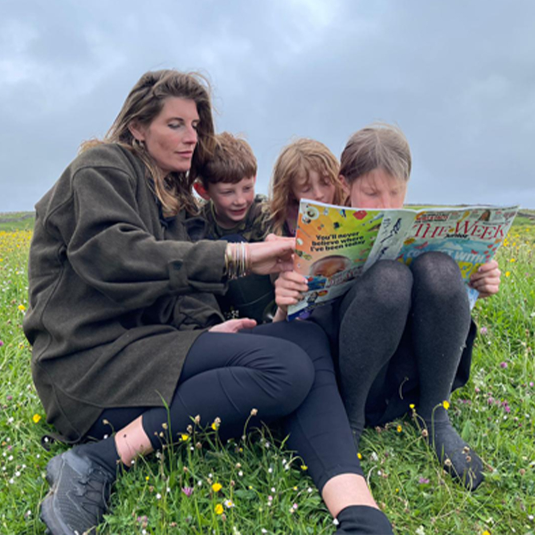 Amanda Owen reading The Week Junior with her children