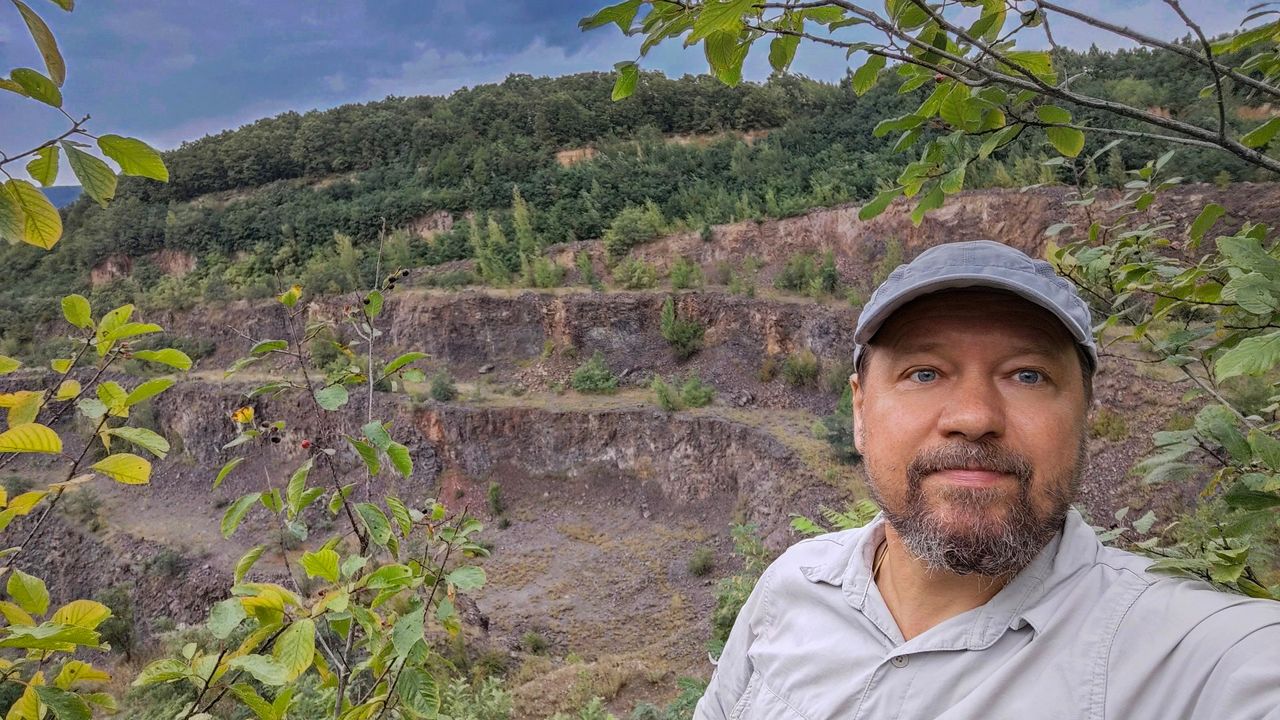 Roman Garba, lead author, takes a photo of himself at the site.