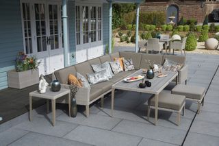covered outdoor dining area with stylish garden dining set