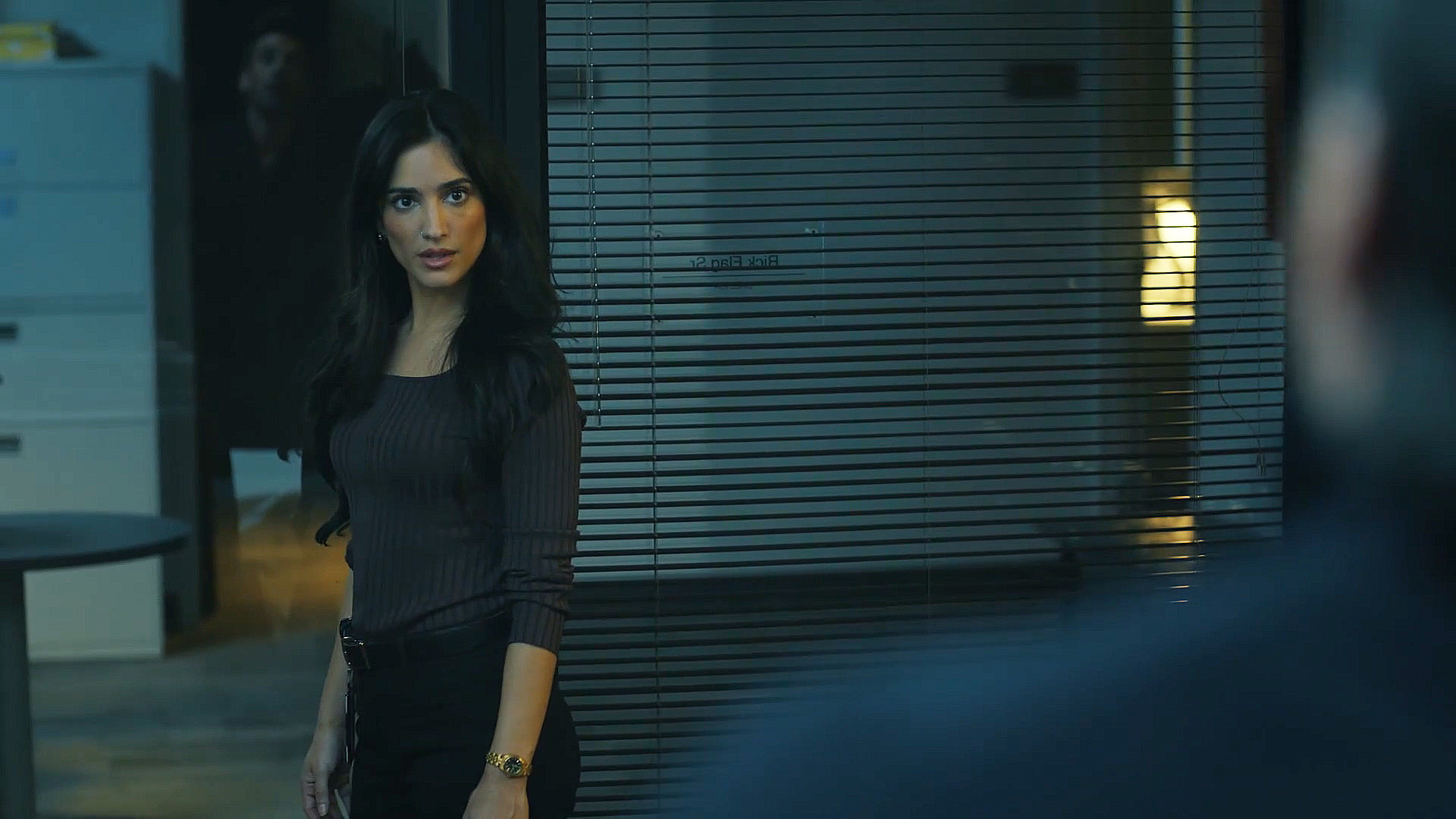 Sasha Bordeaux standing in a doorway in Peacemaker season 2 episode 1