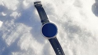 Close-up of the Amazfit Active 2 on a user's wrist while tracking a day of snowboarding