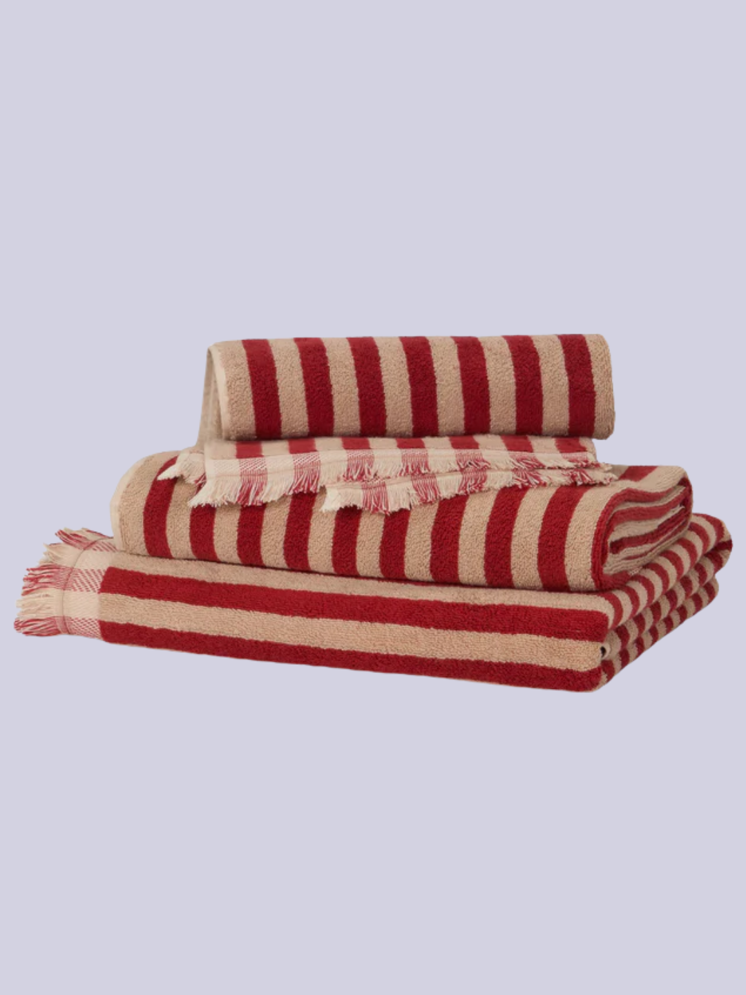 A red and beige striped towel and bath mat set from Piglet in Bed