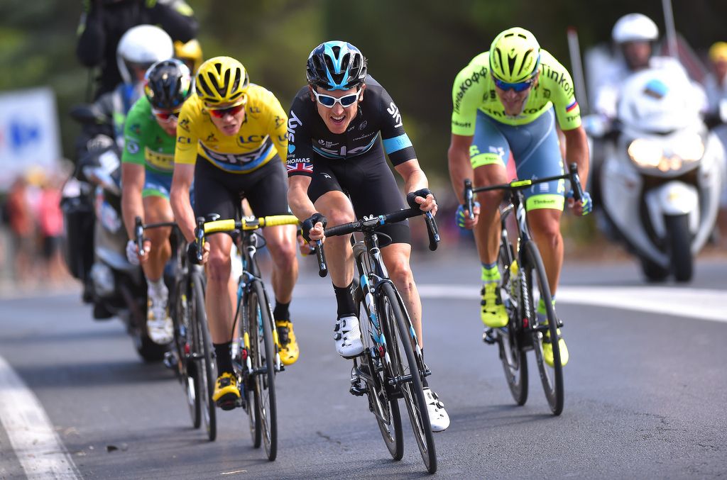 Geraint Thomas does a turn on the front of the four-man break