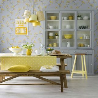 yellow kitchen with table and bench