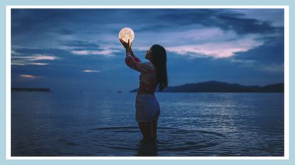 Optical Illusion Of Woman Holding Moon While Standing In Sea Against Sky At Dusk, Moon, Water
