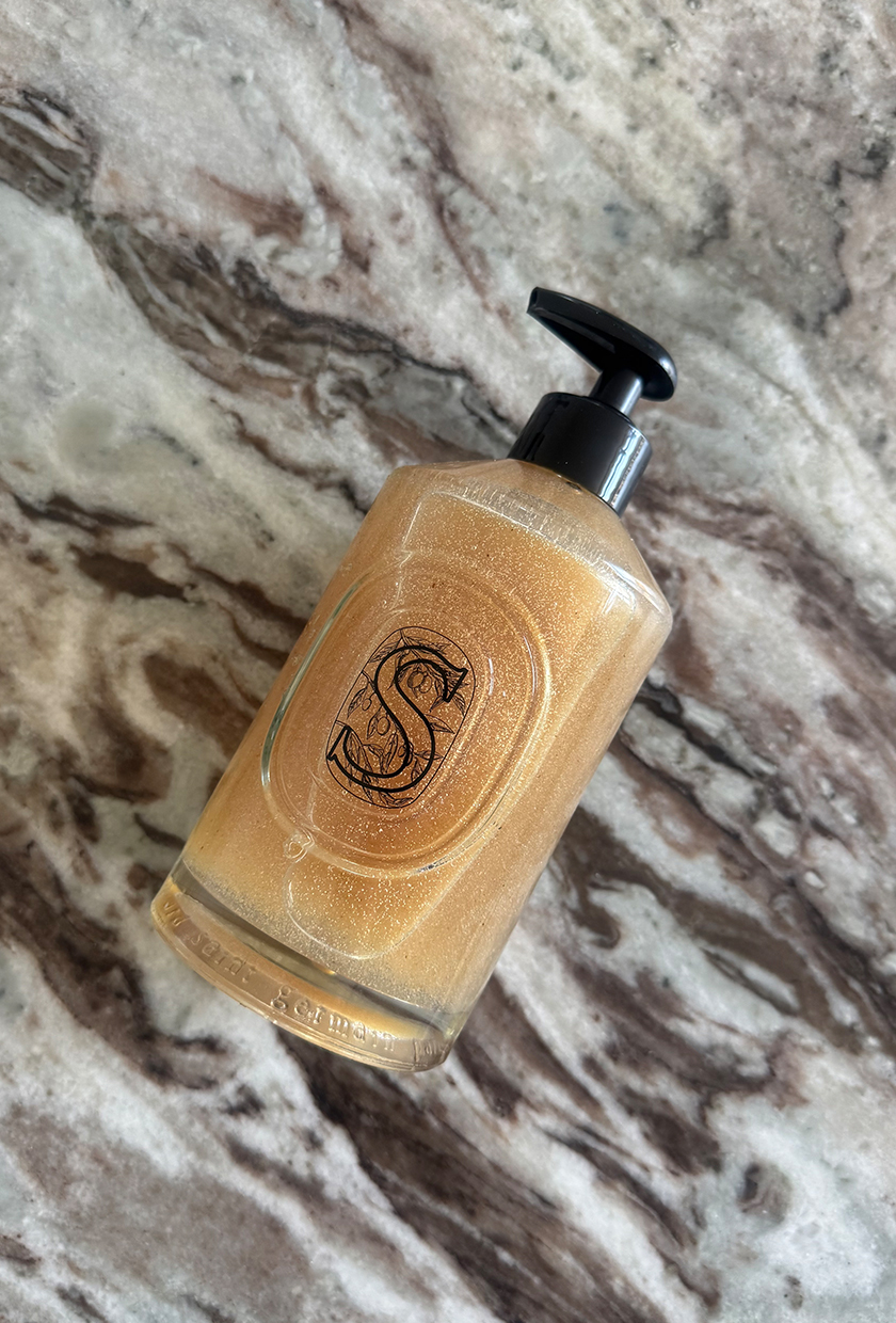 Diptyque exfoliating hand wash on marble table
