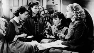 American actresses (left to right) Frances Dee (1909 - 2004), Jean Parker, Katharine Hepburn (1907 - 2003), and Joan Bennett (1910 - 1990) sit and glare at one another as the March girls in this still from a film adaptation of Louisa May Alcott's 'Little Women' directed by George Cukor, 1933